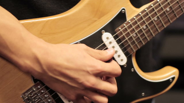 Young Man Playing Electric Guitar