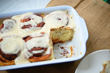 Fresh cinnamom rolls in ceramic baking dish