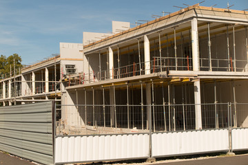 Obraz premium Construction site under construction against blue sky.