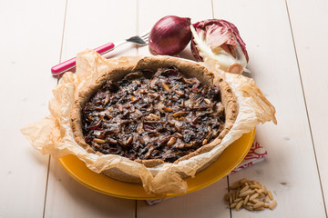 cake with chicory onions and pine nuts