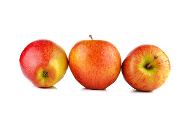 Red yellow apple with green and slice isolated on white
