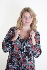 Blond and pretty girl looking at the camera