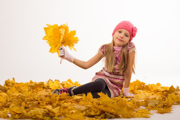 Naklejka na ściany i meble Girl at autumn with yellow leaves