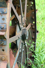 Rusty iron wheel from an old tractor