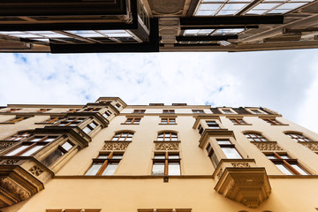 Naklejka premium facades apartment houses on narrow street Vienna
