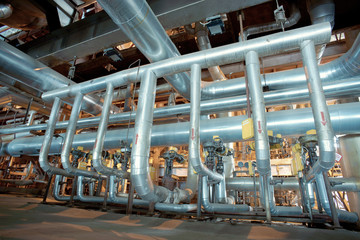 equipment, cables and piping as found inside of a modern industr
