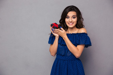 Happy woman holding jewelry box