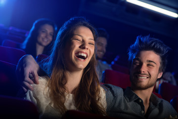 Young loving couple at the cinema