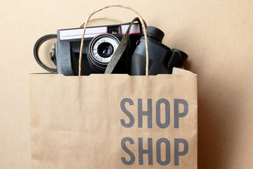 Shopping technology concept - camera and binoculars