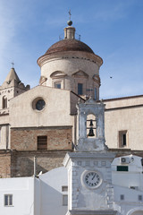 Fototapeta premium Vertical view of bell tower with clock in Pisticci south Italy