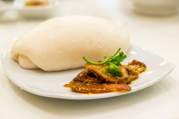 Chinese steamed bun and Barbecued red pork white sauce
