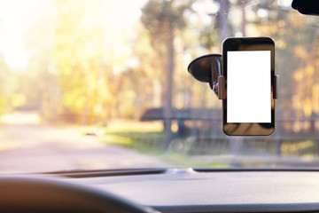mobile phone with blank screen in car windshield holder