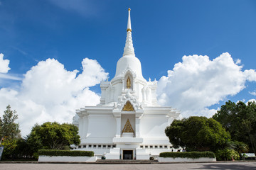 Big white Buddhist temple with cloud clear blue sky in Thailand