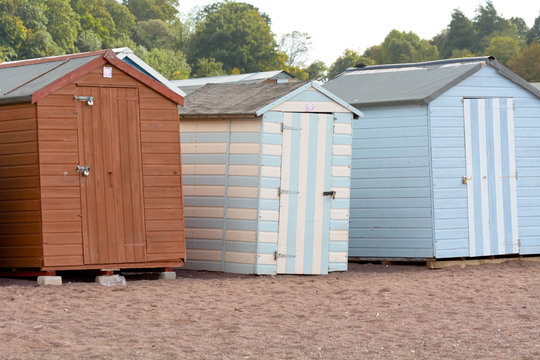 A row of wooden beach huts in Teignmouth, Devon, England