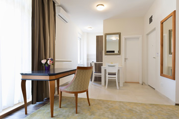 Interior of a classic styled apartment with wooden furniture