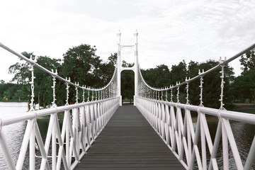 White bridge in city park at Bung Ta Lua Water Park Nakhon Ratch