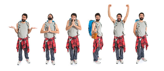Fototapeta premium Lucky backpacker over isolated white background