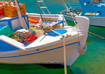 traditional fishing boats  docked at the port of Vathi village in Kalymnos island in Greece