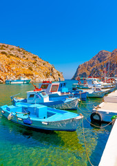 traditional fishing boats  docked at the port of Vathi village in Kalymnos island in Greece - 94657847