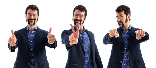 Vintage young man doing victory gesture