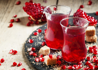Hot red tea with pomegranate and cane sugar in authentic Middle