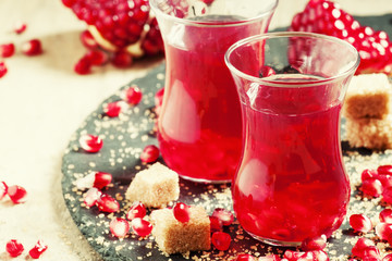 Hot red tea with pomegranate and cane sugar in authentic Middle