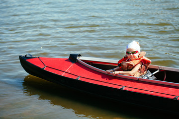 Little girl in a kayak. Family holiday.