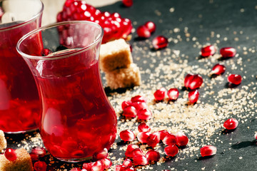 Hot red tea with pomegranate and cane sugar in authentic Middle