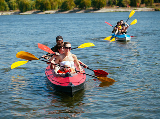 People of all ages in a kayak. Family holiday.