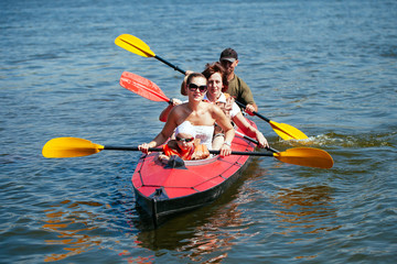 People of all ages in a kayak. Family holiday.