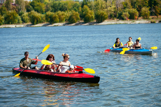 People of all ages in a kayak. Family holiday.