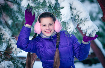 portrait of a young girl in winter park