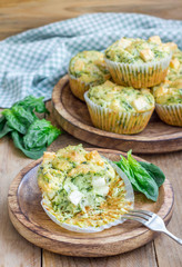 Freshly baked snack muffins with spinach and feta cheese