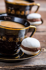 Cup of coffee and one little macaroon