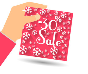 Winter sale. Discount 30 percent. Hand holds percent discount on the price. Gift card with a winter pattern with snowflakes in a flat style.