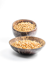 soybeans in a half of coconut shell