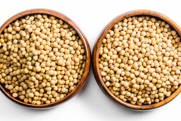 soybeans in wooden bowl isolated on white background..