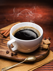 Cup of coffee and cane sugar cubes.