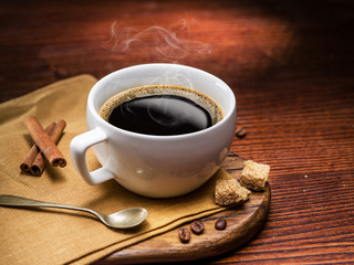 Cup of coffee and cane sugar cubes.