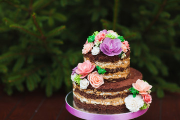 Wedding cake. Naked Wedding cake with flowers