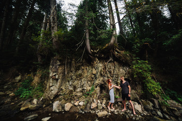 beautiful couple on the background of forest