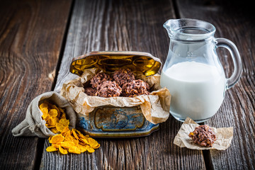Sweet cocoa balls with ingredients in old box