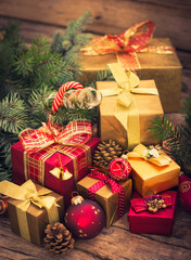 Fototapeta na wymiar Christmas gifts on the wooden background 