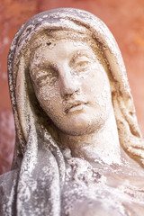 portrait of a weathered maria sculpture