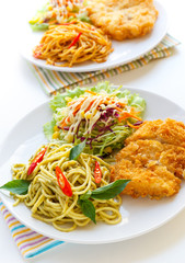 Thai green curry  spaghetti with fried chicken.