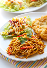 Thai red curry  spaghetti with fried fish.