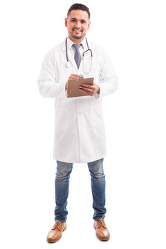 Hispanic nutritionist taking some notes
