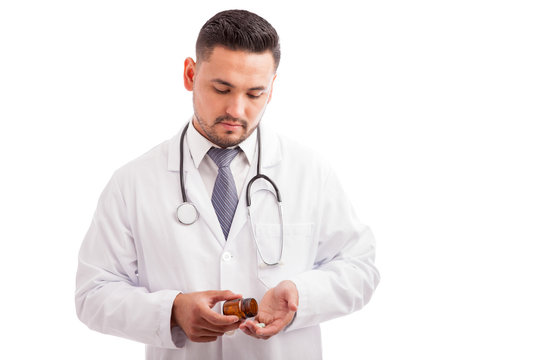 Male nutriologist with some pills