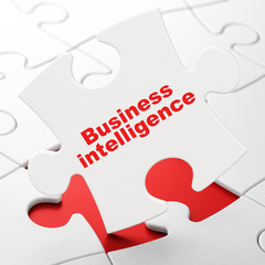 Finance concept: Business Intelligence on puzzle background