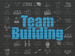 Finance concept: Team Building on wall background